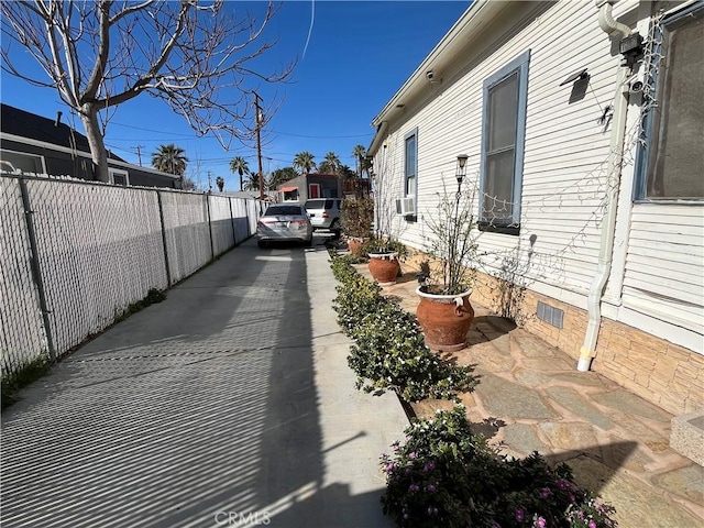 view of side of property with cooling unit