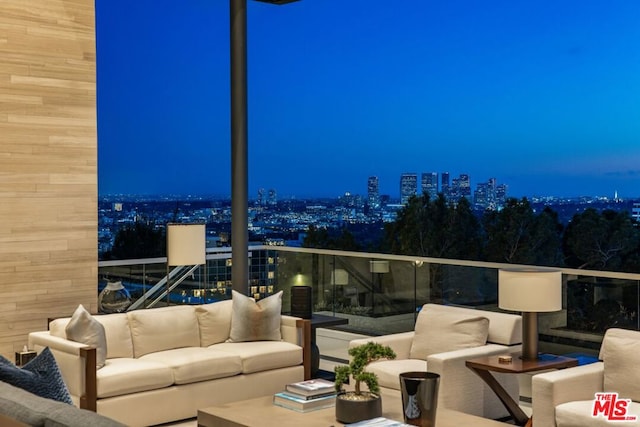 exterior space featuring a balcony and an outdoor living space