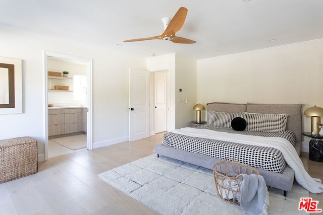 bedroom featuring light wood-type flooring, ceiling fan, ornamental molding, and ensuite bath