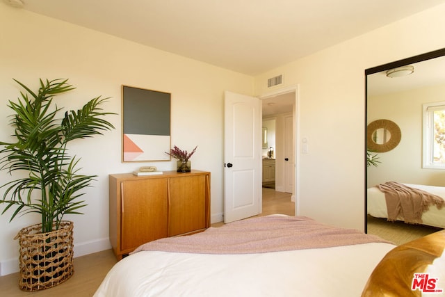 bedroom featuring light wood-type flooring