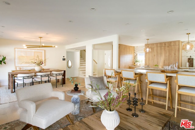 living room with a chandelier and hardwood / wood-style floors