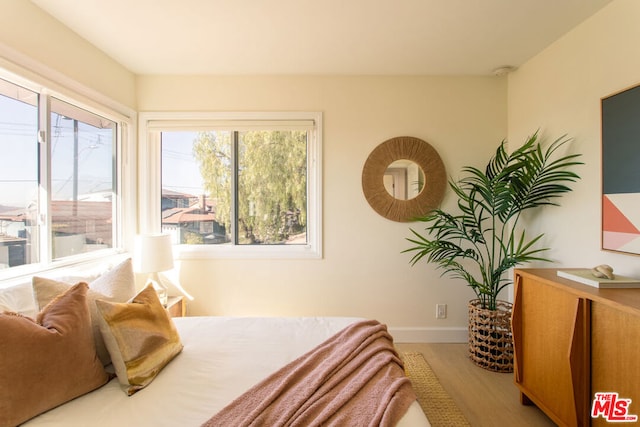 bedroom with light wood-type flooring