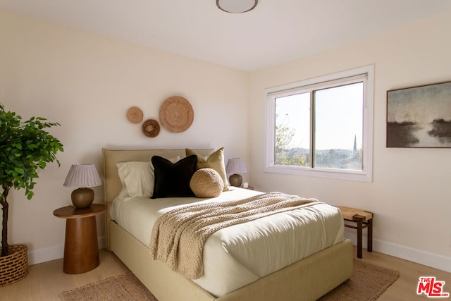 bedroom with light wood-type flooring