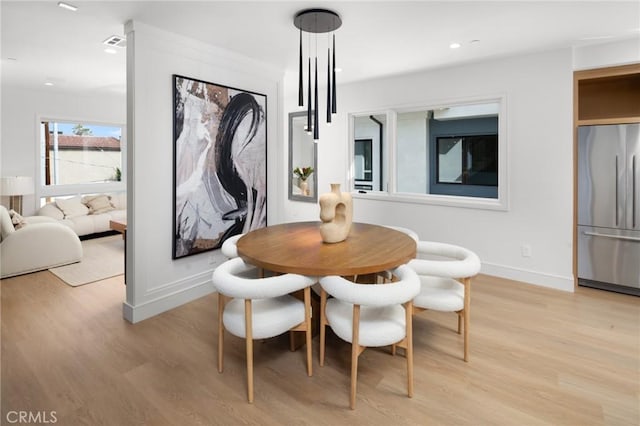 dining room with light hardwood / wood-style floors