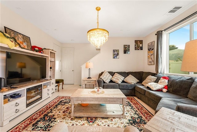 living room featuring a notable chandelier