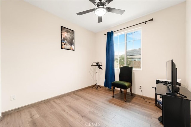 sitting room with light hardwood / wood-style flooring and ceiling fan