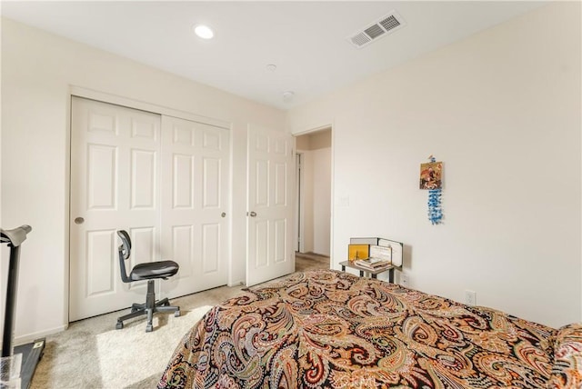 carpeted bedroom featuring a closet