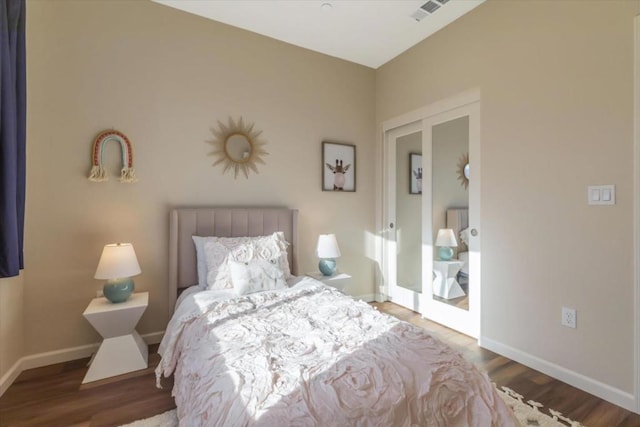 bedroom with hardwood / wood-style floors