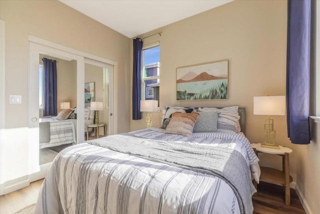 bedroom with hardwood / wood-style floors