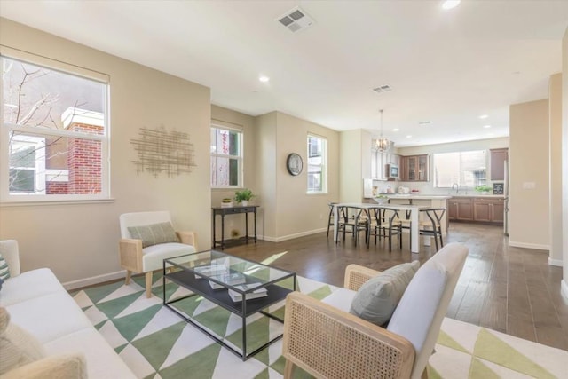 living room with dark hardwood / wood-style flooring