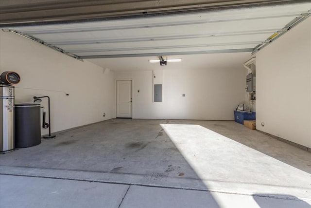 garage with a garage door opener and electric panel