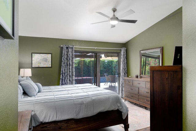 bedroom featuring ceiling fan, lofted ceiling, and access to outside