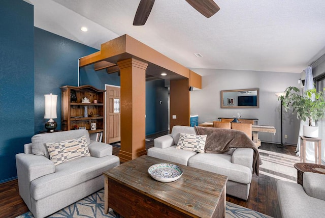 living room with ceiling fan, lofted ceiling, wood-type flooring, and decorative columns