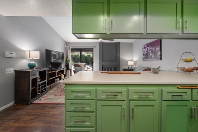 kitchen featuring ceiling fan, dark hardwood / wood-style flooring, and green cabinetry