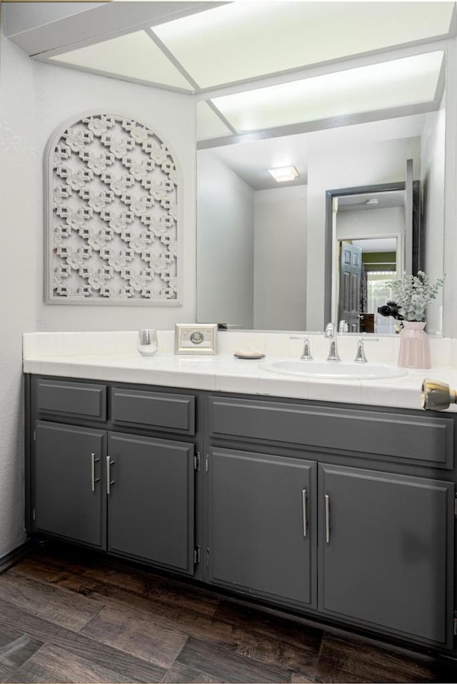 bathroom featuring hardwood / wood-style flooring and vanity