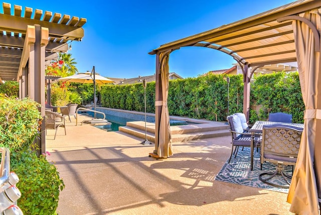 view of patio / terrace featuring a fenced in pool and a pergola