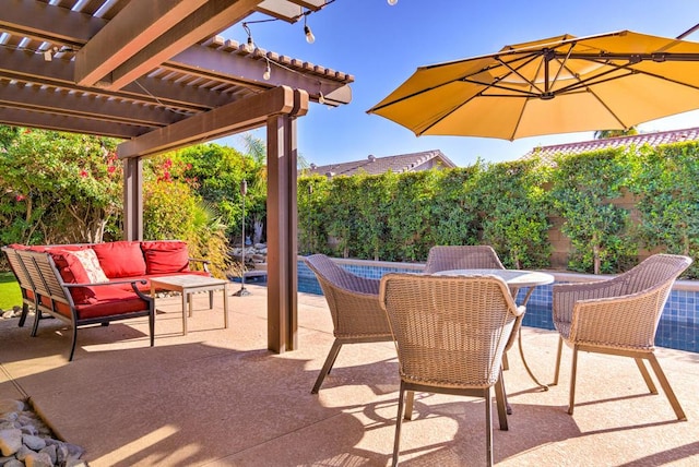 view of patio / terrace featuring a pool, an outdoor living space, and a pergola