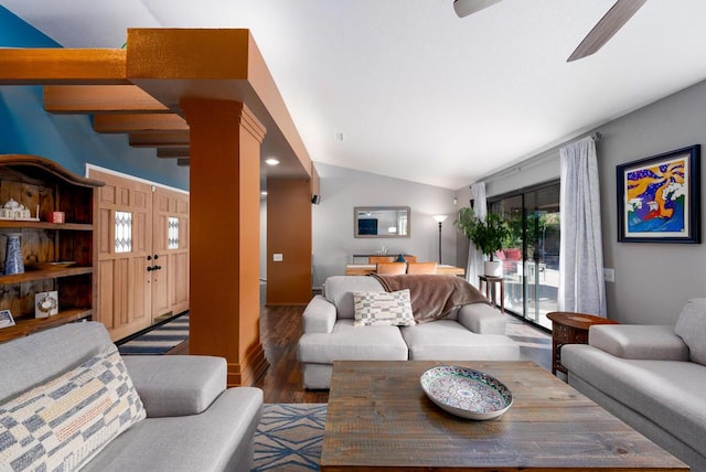 living room featuring ceiling fan, wood-type flooring, and vaulted ceiling