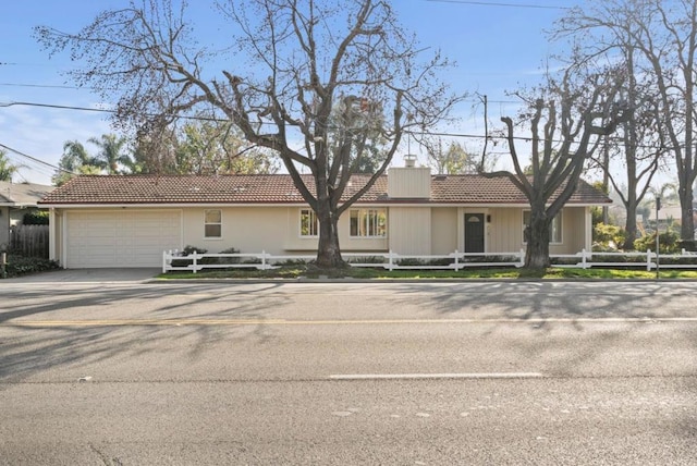 ranch-style house featuring a garage