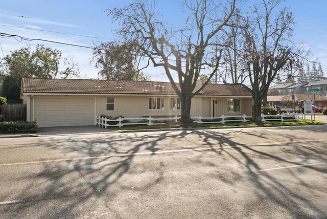 back of property with a garage