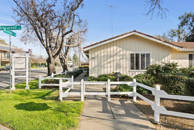 view of home's exterior with a yard