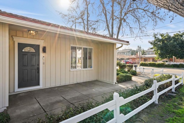 doorway to property featuring a patio