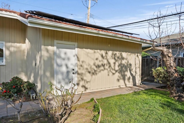 view of home's exterior with a lawn