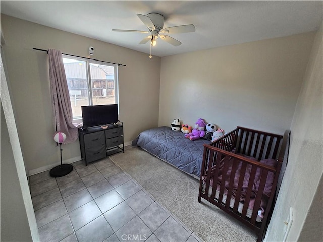 bedroom with light tile patterned floors and ceiling fan