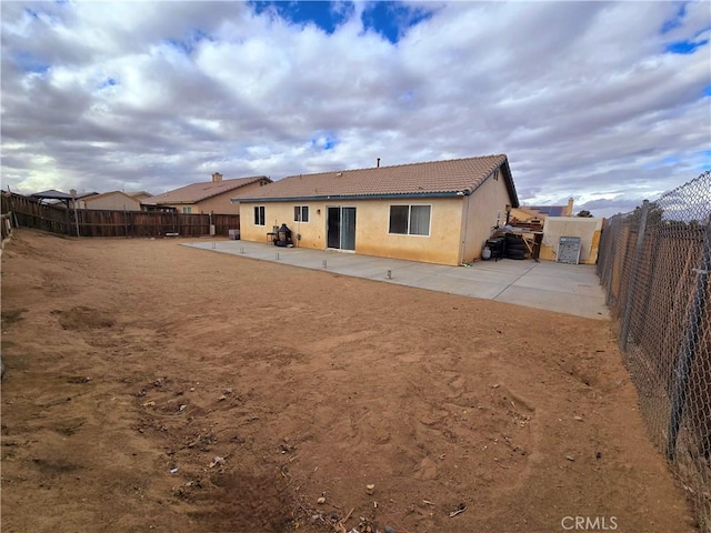 back of house featuring a patio