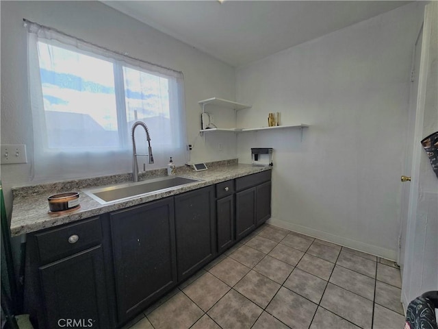 kitchen with sink and light tile patterned floors