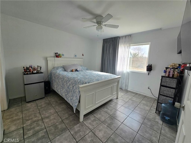 tiled bedroom featuring stainless steel refrigerator and ceiling fan