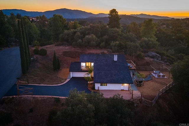 aerial view at dusk with a mountain view