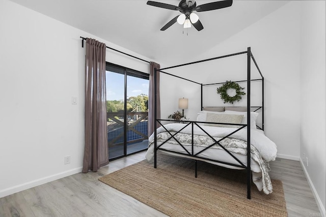 bedroom featuring ceiling fan, light hardwood / wood-style flooring, and access to outside