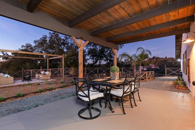 view of patio terrace at dusk