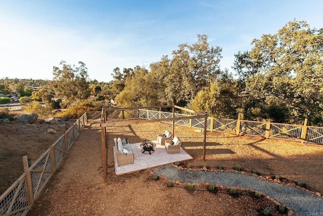 view of yard with a fire pit