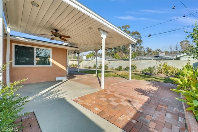 view of patio featuring ceiling fan