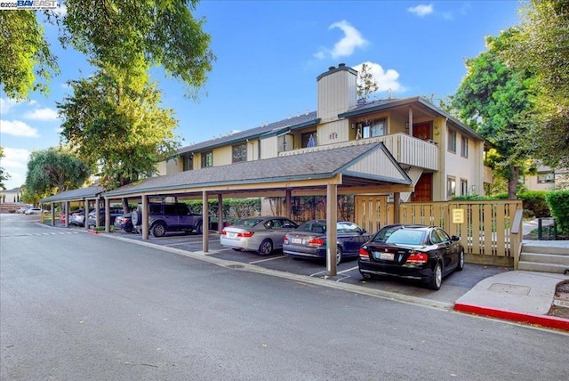 view of car parking with a carport