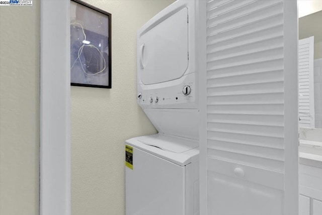 laundry room featuring stacked washer and dryer