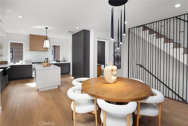 dining area with light wood-type flooring