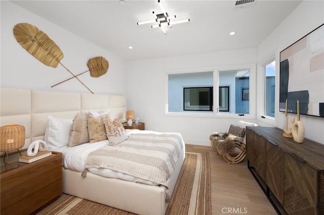 bedroom with light wood-type flooring