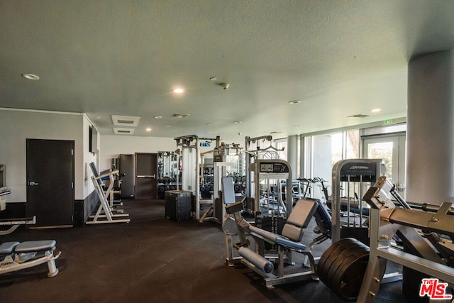 workout area featuring a textured ceiling