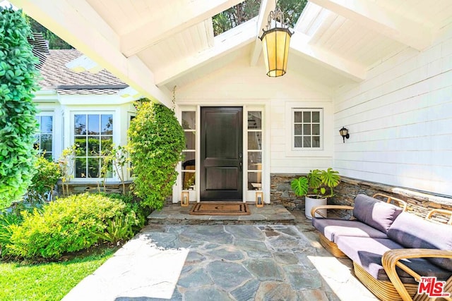 doorway to property featuring a patio area