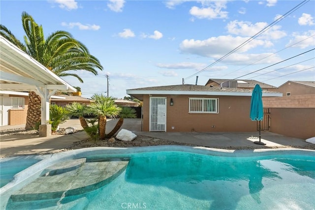 view of swimming pool featuring a patio