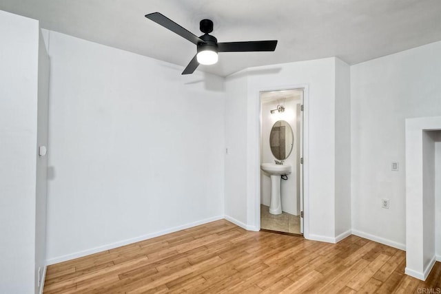 interior space with ceiling fan and light hardwood / wood-style flooring