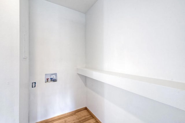 washroom featuring wood-type flooring and washer hookup