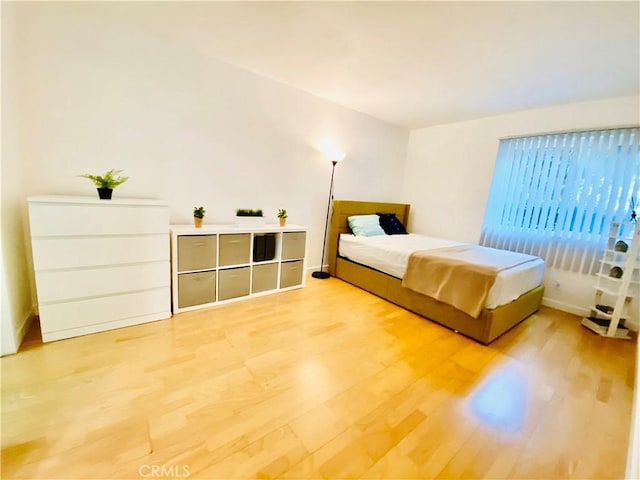 bedroom featuring wood-type flooring