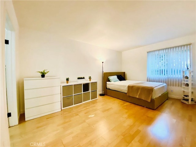 bedroom with light wood-type flooring