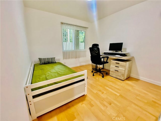 bedroom featuring hardwood / wood-style flooring