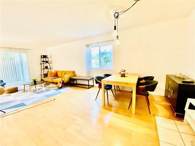 dining area with light hardwood / wood-style floors