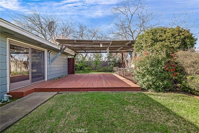 wooden terrace featuring a pergola and a yard